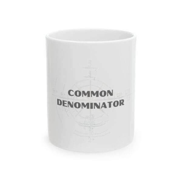 A white coffee mug with the words " common denominator ".