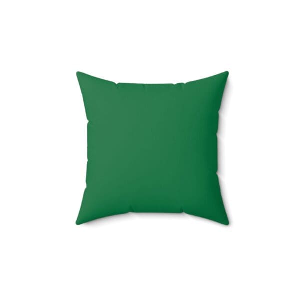 A green pillow with a white background