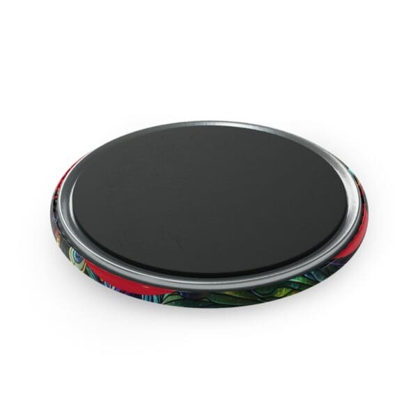 A black and red circular object on top of a white surface.