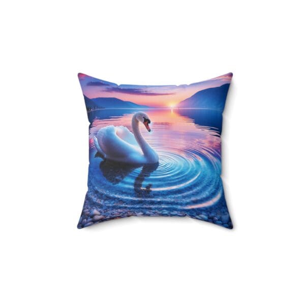 A swan swimming in the water at sunset.