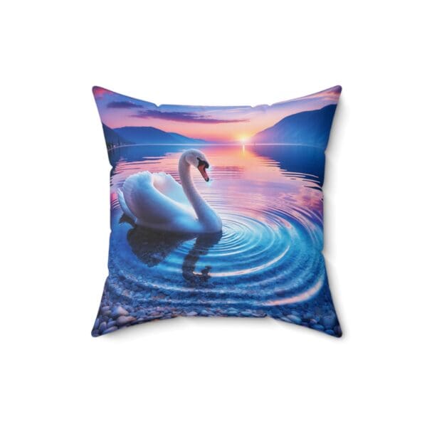 A swan swimming in the water at sunset.