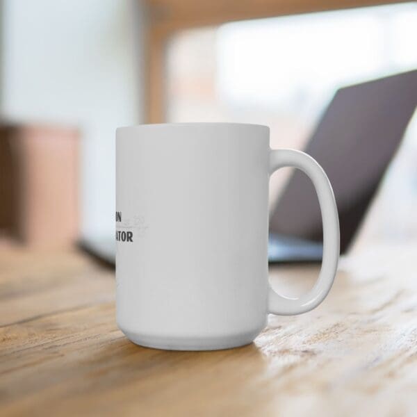 A coffee mug sitting on top of a wooden table.